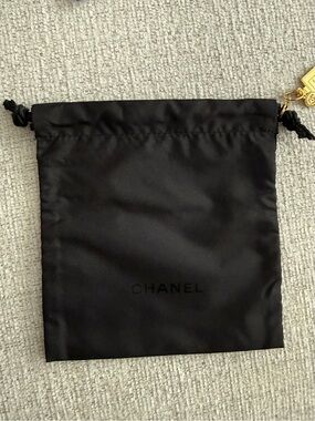 CHANEL Black Satin Drawstring Pouch with Gold Accent